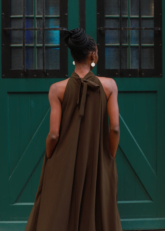 womanwearing a long dark green dress